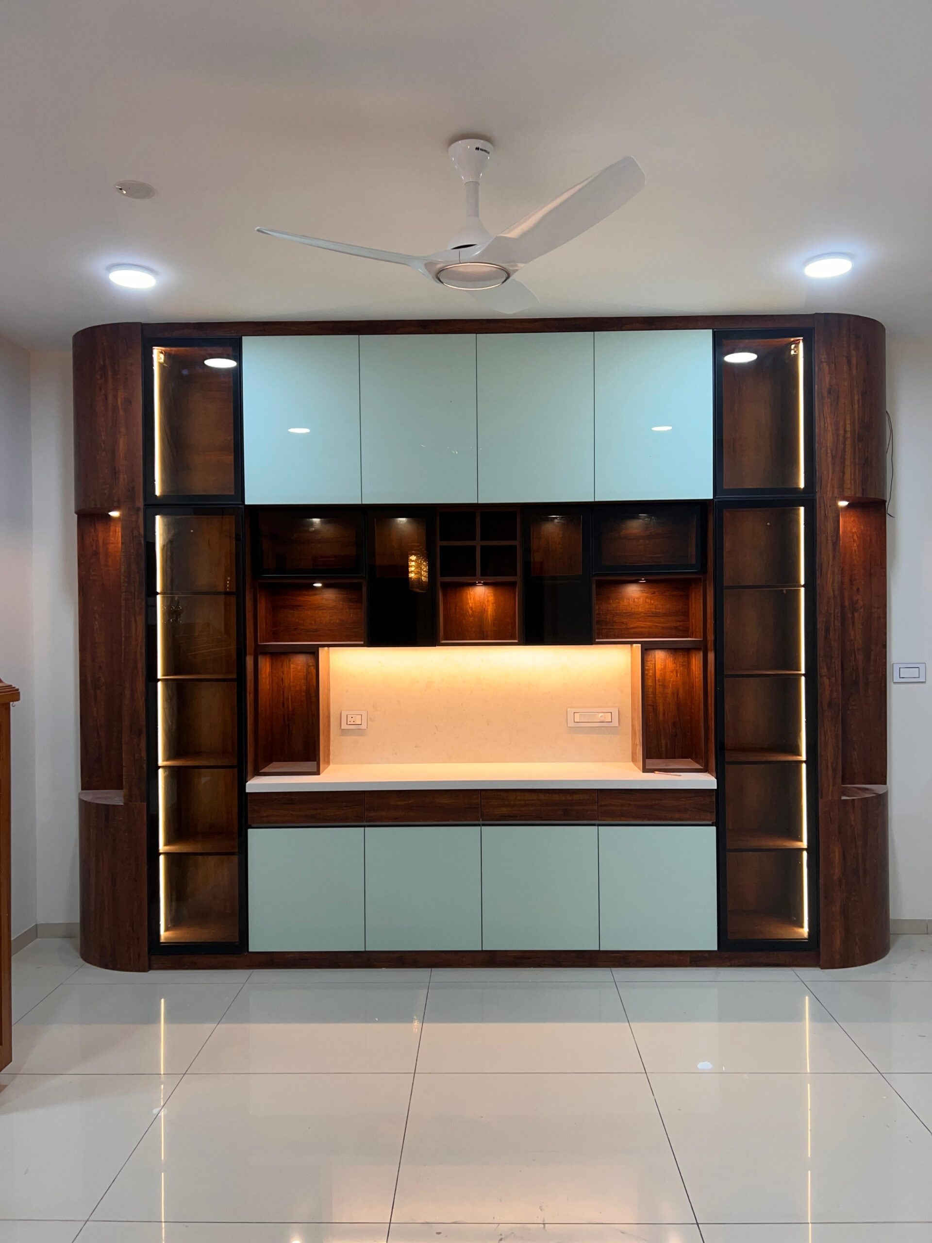 Carved timber screen dividing the living and dining areas of a completed AG Design and Build home